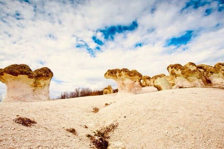 A desert landscape with rock formations. 3
