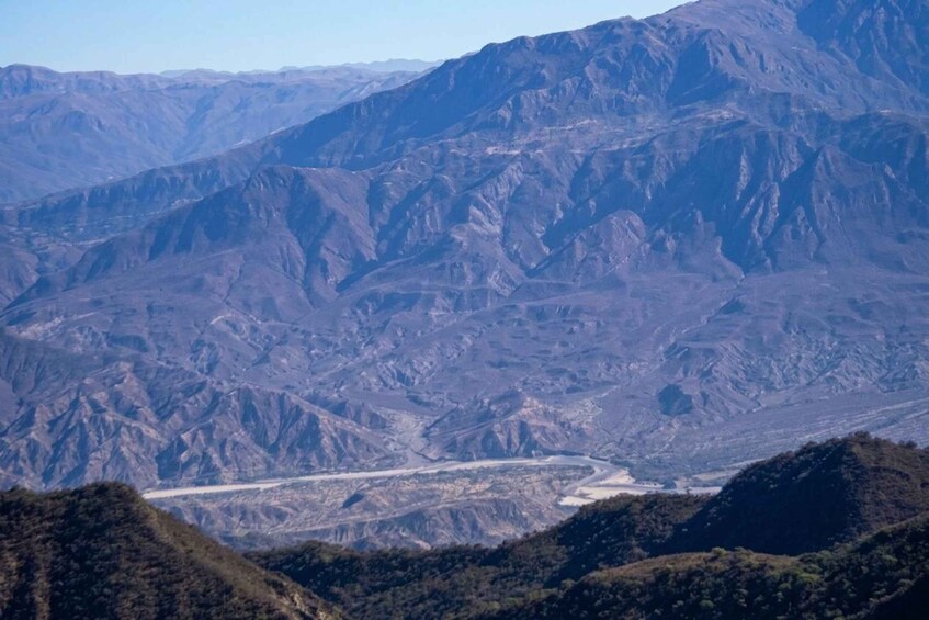 A mountainous landscape with a river valley. 5