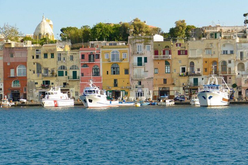A harbor with colorful buildings and boats. 4