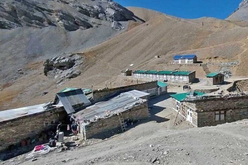 A mountainous area with traditional buildings and a clear sky. 4
