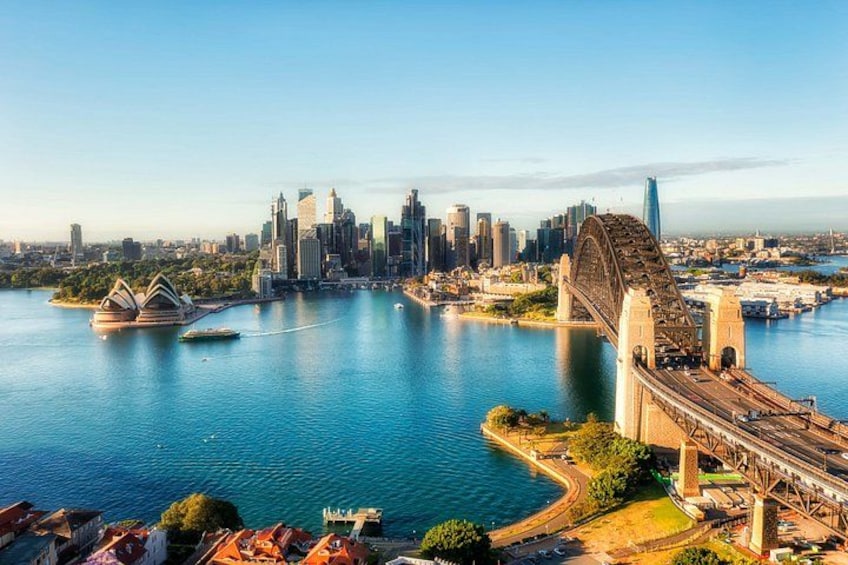 A city skyline with a prominent bridge and a waterfront. 3