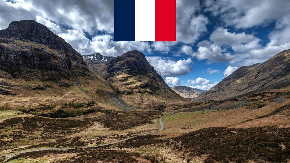 A mountainous landscape with a winding road. 1
