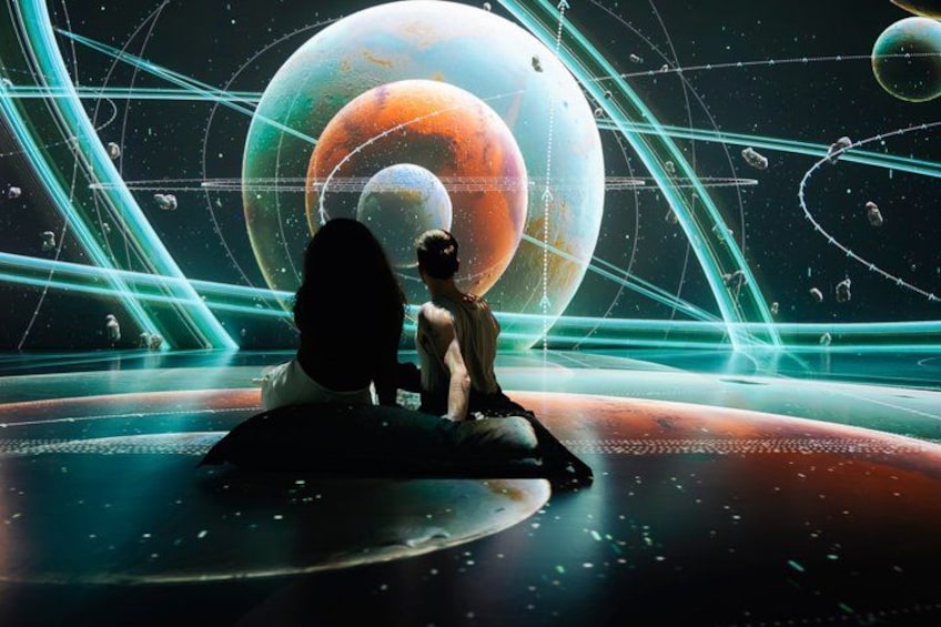 A futuristic space scene with two figures observing a large planet. 2