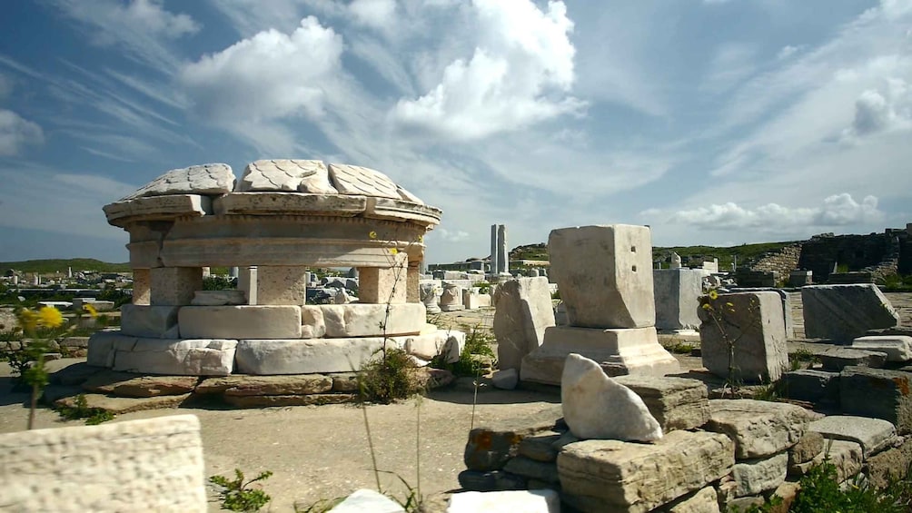 Ancient ruins with stone structures and columns. 4