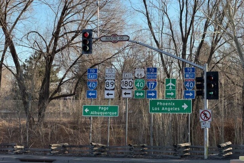 A traffic sign with directions to Phoenix, Los Angeles, Page, and Albuquerque. 1