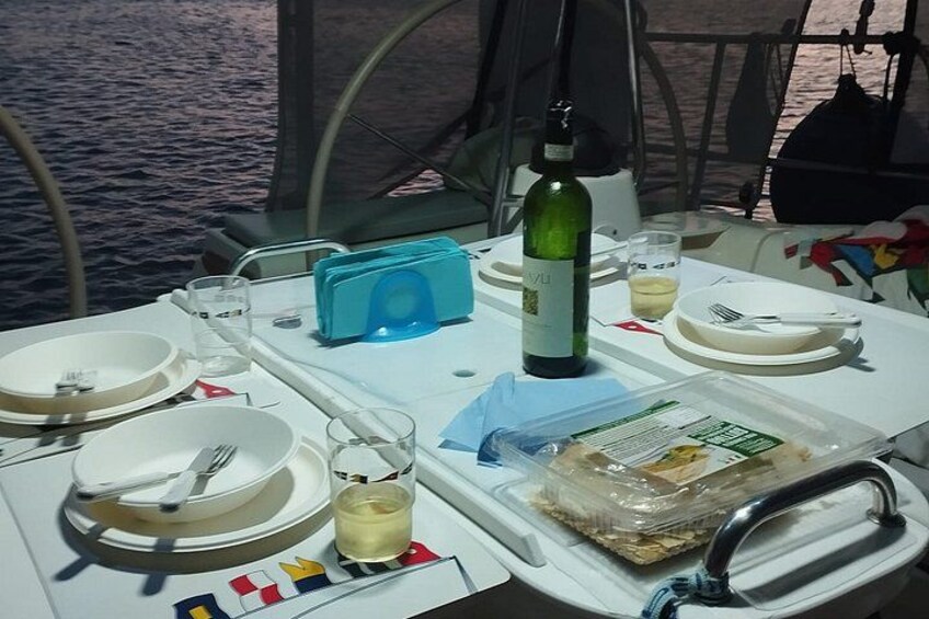 Sunset on a sailboat in the Gulf of Cagliari with aperitif 2