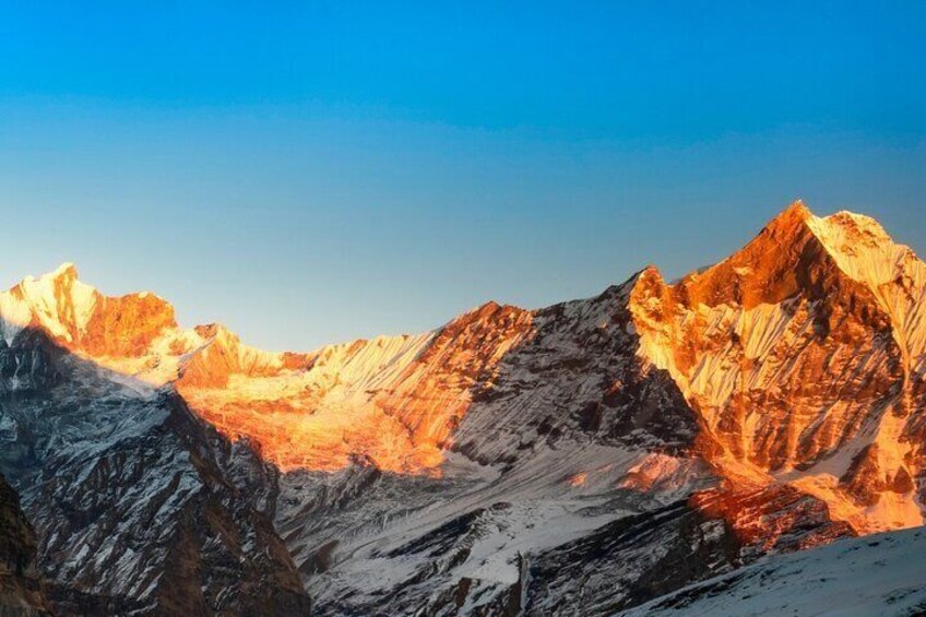 Snow-covered mountain peaks with a clear sky. 1