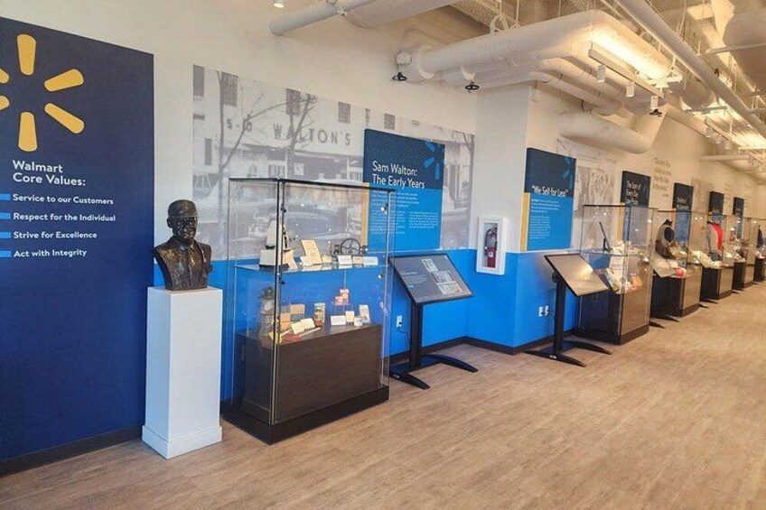 A museum exhibit with displays and informational panels. 3