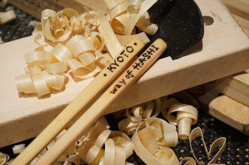 Wooden shoji screens, a traditional Japanese sliding door, and a wooden tool with text. 1