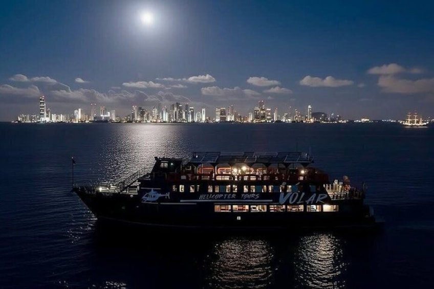 A ferry named 'Helicopter Tours' with a city skyline in the background. 4