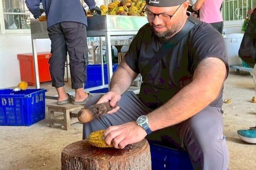 A person using a hammer on a wooden post. 5