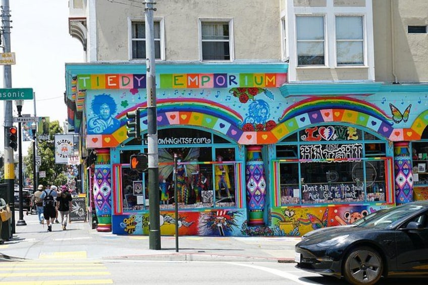 A colorful storefront with vibrant murals and signage. 2