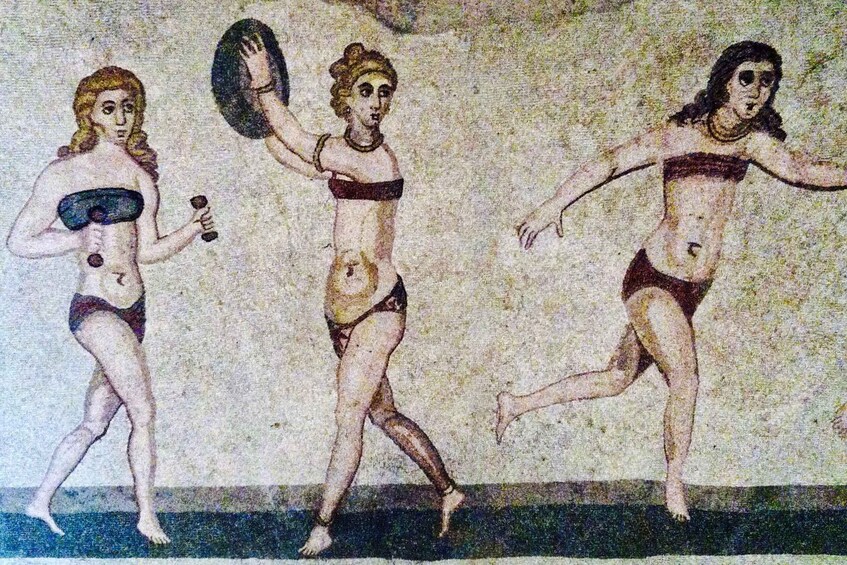 A mosaic with three figures in dynamic poses, possibly depicting a mythological scene. 1