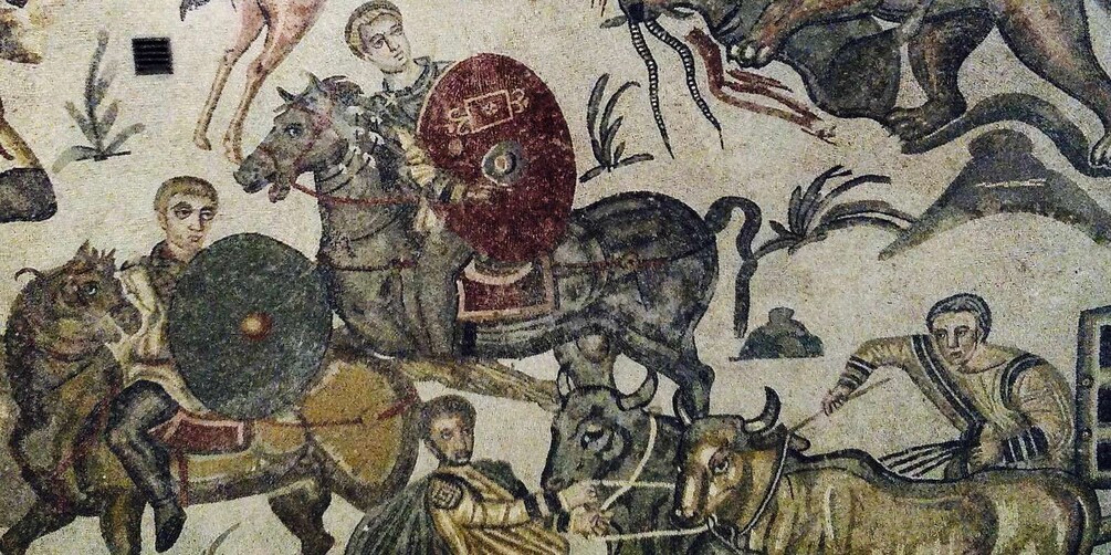 A mosaic with figures on horseback, a shield, and a bull. 5