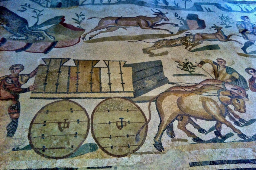 A mosaic with a chariot, horses, and figures in ancient attire. 2