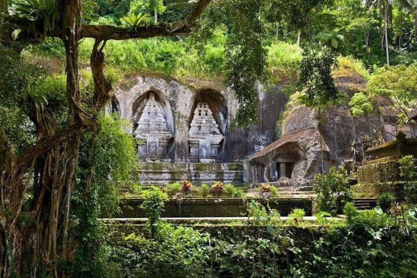 A temple complex with arched structures surrounded by lush greenery. 4