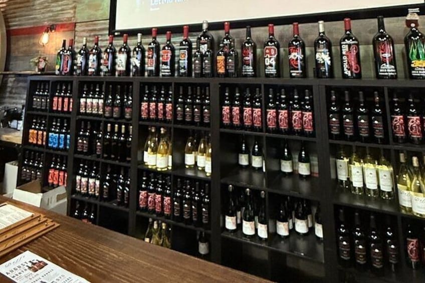 A wine store with shelves of various wine bottles. 2