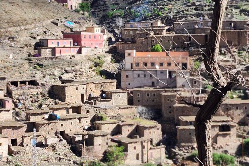 A rugged mountainous village with traditional adobe buildings. 3