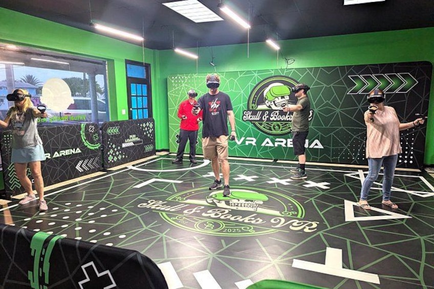 A VR gaming area with a green and black design, including a logo and text on the wall. 4