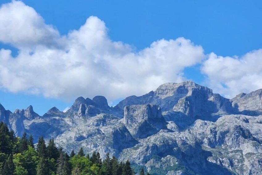 A mountain range with rugged peaks and a clear sky. 5