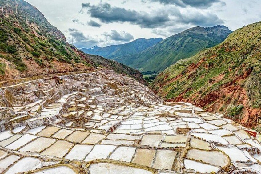 Terraced stone structures in a mountainous landscape. 4