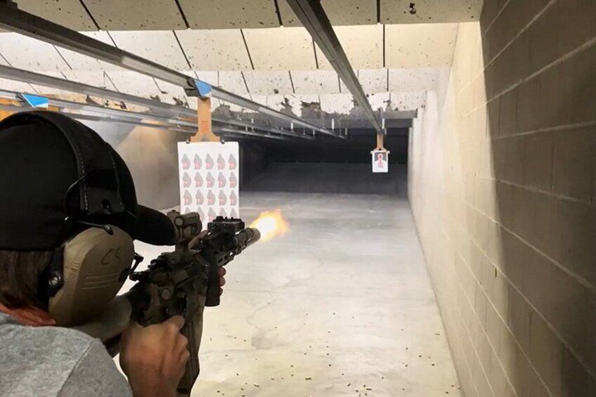 Sharp Shooters Indoor Range experience with a wall of guns 1