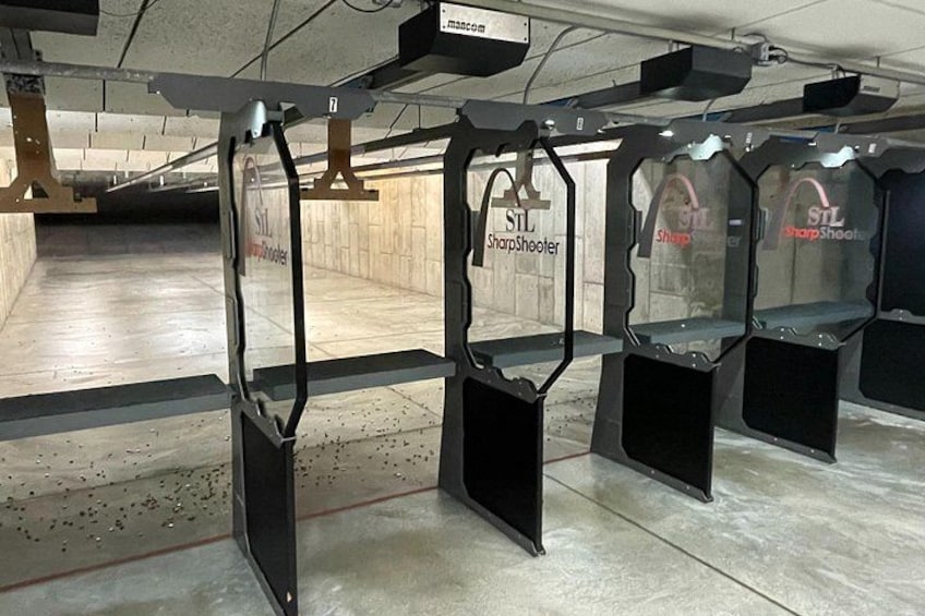Sharp Shooters Indoor Range experience with a wall of guns 4