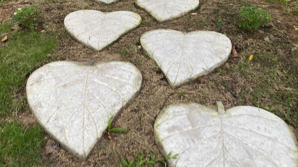 Heart-shaped stone slabs on grass. 2