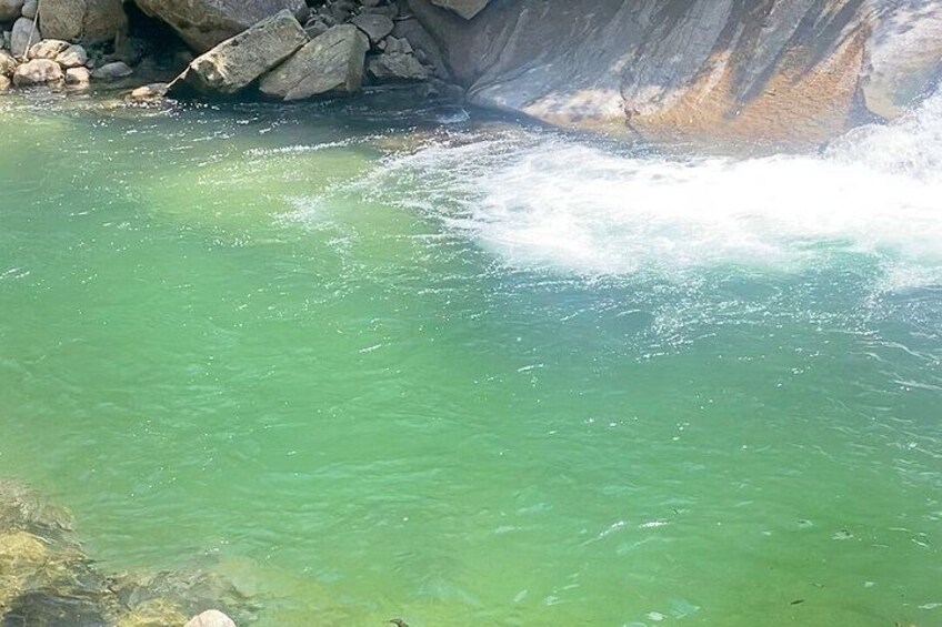 A river with clear water flowing through a rocky landscape. 2