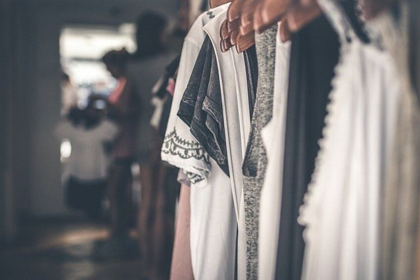 A clothing rack with various garments. 3