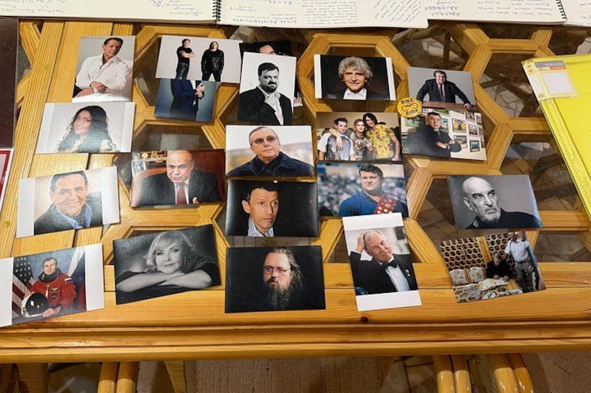 A wooden display with photographs of various people. 3