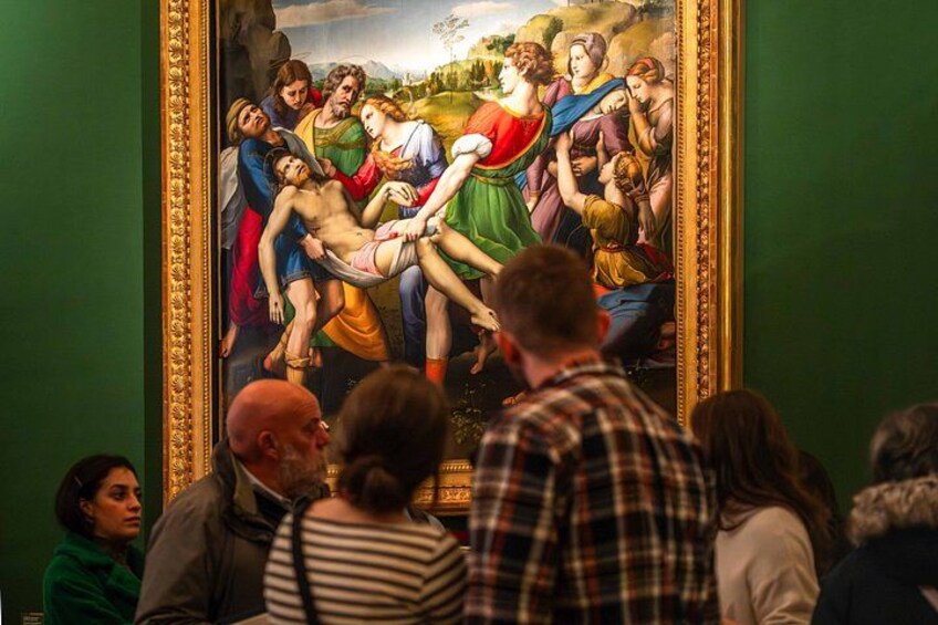 A classical painting with a group of people in a pastoral setting, framed and displayed in a museum. 3