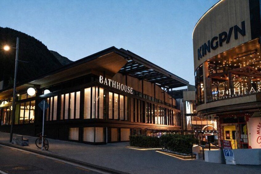 A Bathhouse building with a Kingpin store adjacent to it. 2