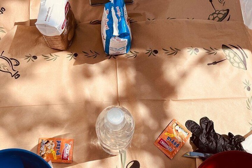 A table with food items and a water bottle. 5