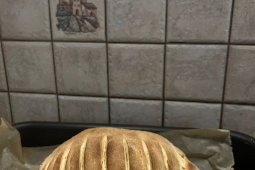 A loaf of bread on a baking tray. 2