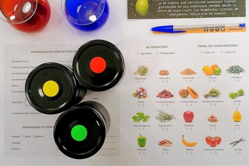 Three black jars with colored liquids, a pen, and a document with food images and a consumer panel. 5