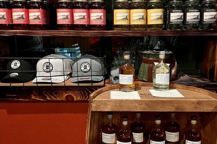 A bar with shelves of bottles and glasses. 3