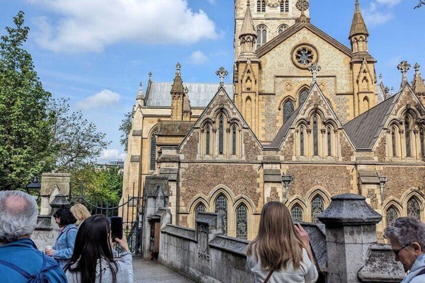 A historic church with a clock tower and pointed arches. 3