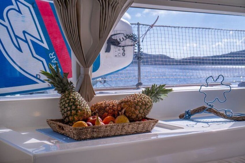 A window with a basket of fruits on a boat. 4