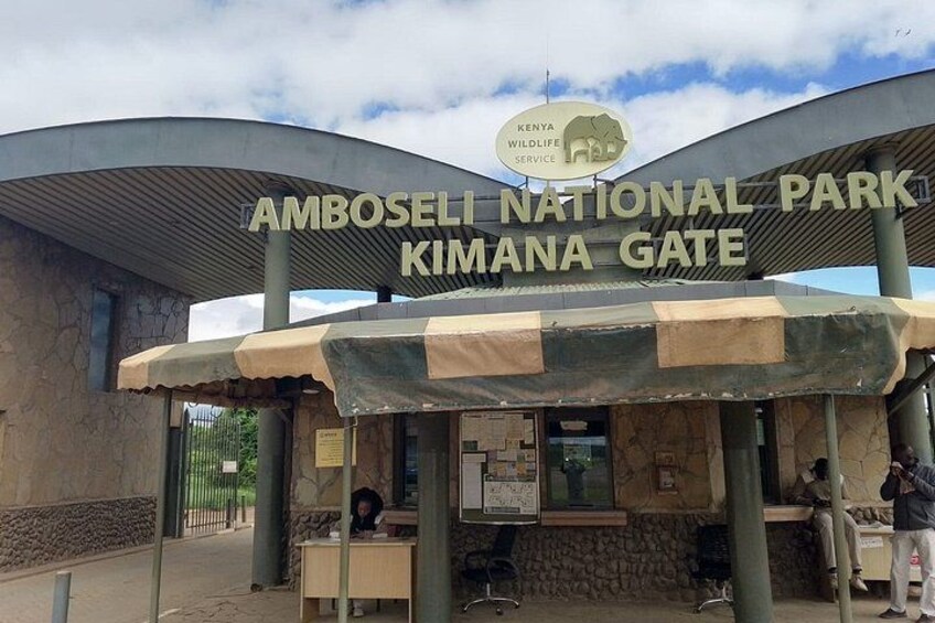 The entrance to Amboseli National Park with a sign for the Kimana Gate. 1