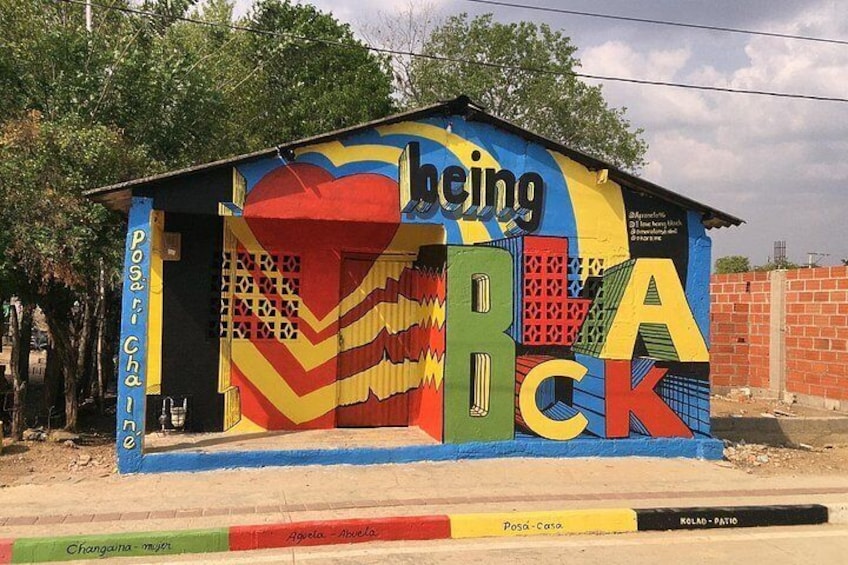A colorful mural on a building with large letters spelling 'BECK' and 'Posada Casa.' 2
