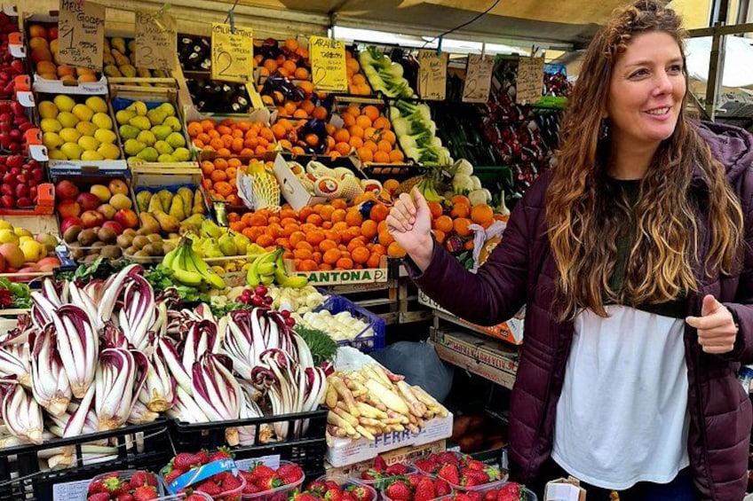 A fruit and vegetable market with various produce on display. 5