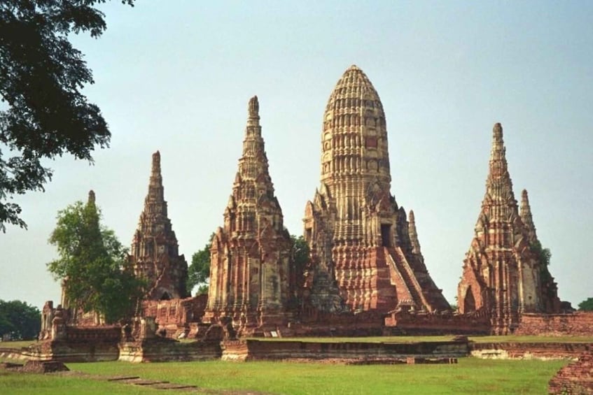 An ancient temple complex with multiple tiered towers and intricate stone carvings. 5