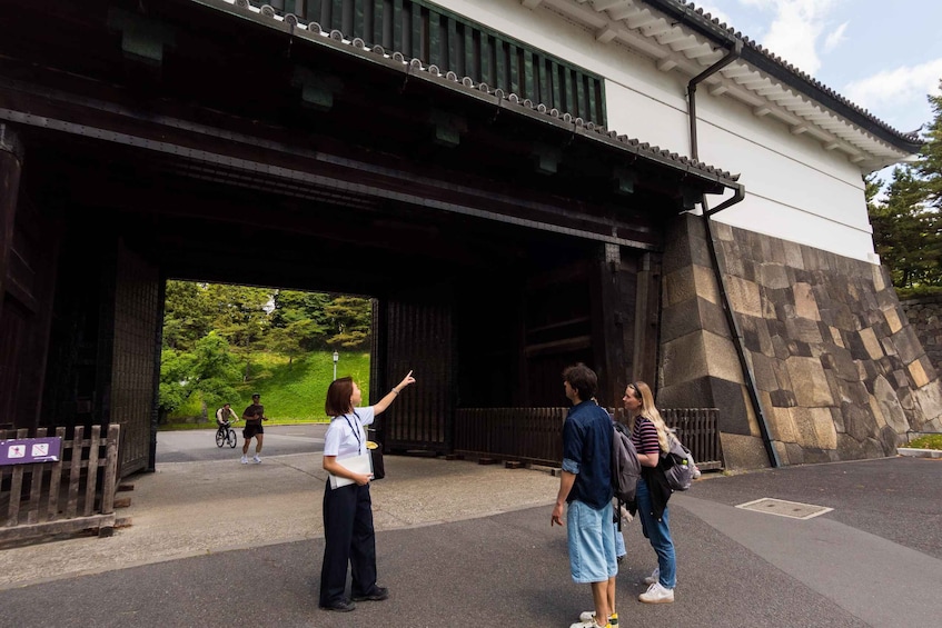 A traditional building with a tiled roof and a stone wall. 5