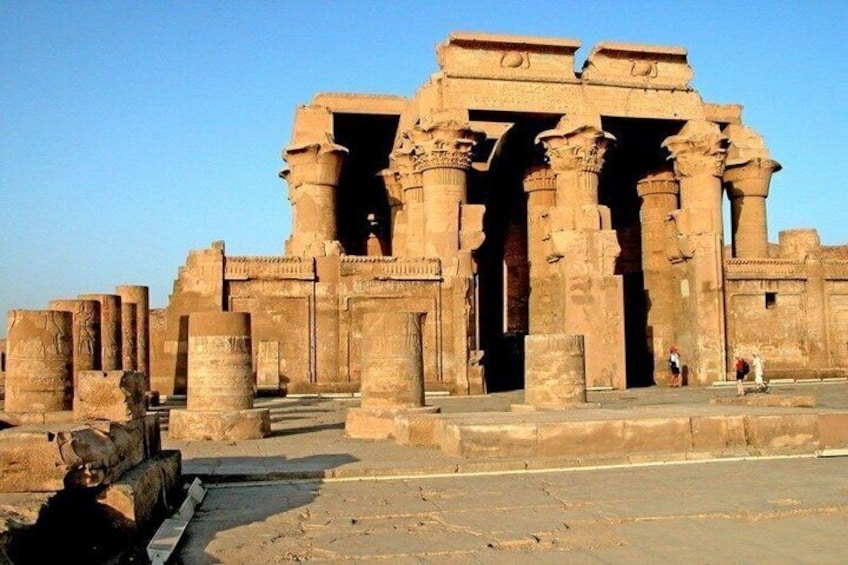 An ancient temple with large columns and a grand entrance. 2