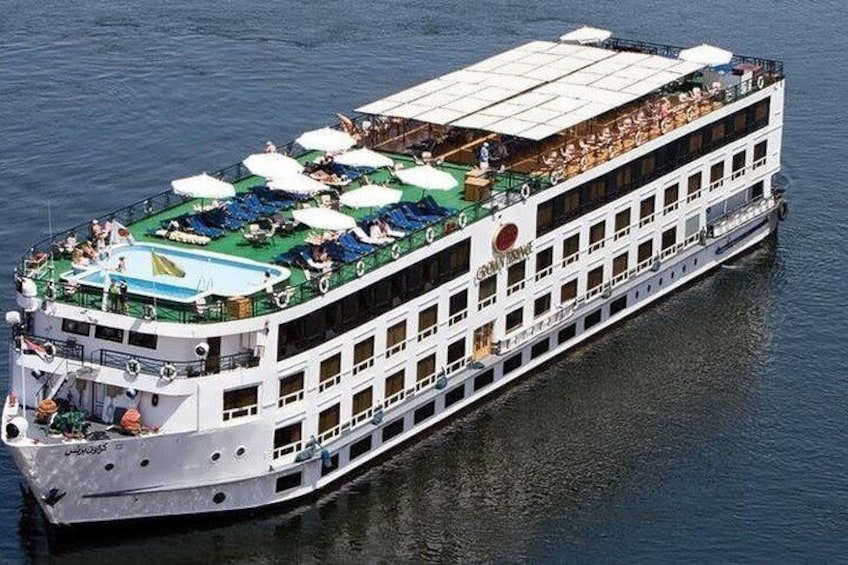 A river cruise ship with multiple decks, outdoor seating areas, and a swimming pool. 1