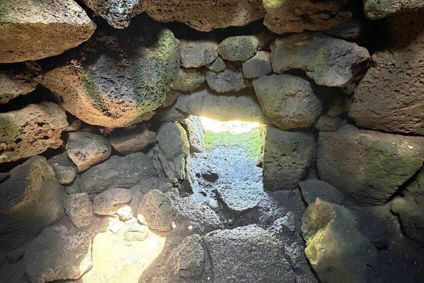 A stone wall with a narrow opening. 2