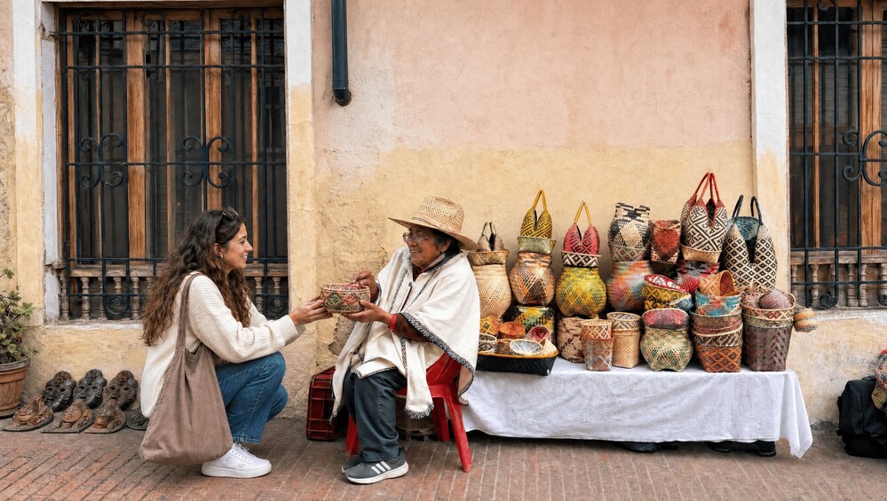 A street vendor selling woven baskets and bags. 3