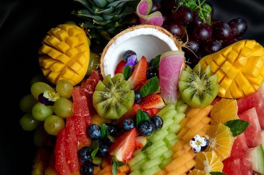 A variety of fresh fruits including mango, kiwi, strawberries, grapes, and watermelon. 4