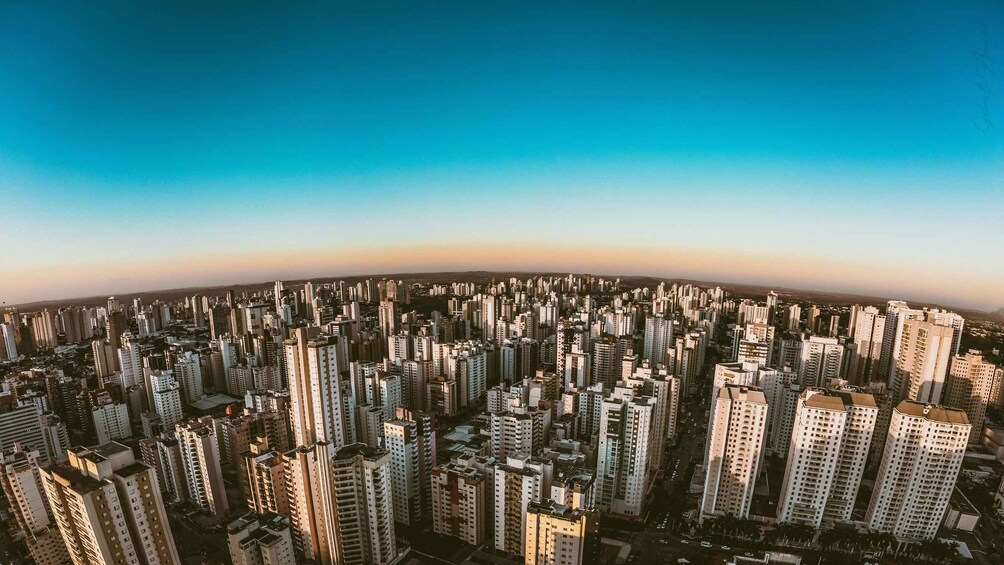 A densely packed urban skyline with numerous high-rise buildings under a clear sky. 2